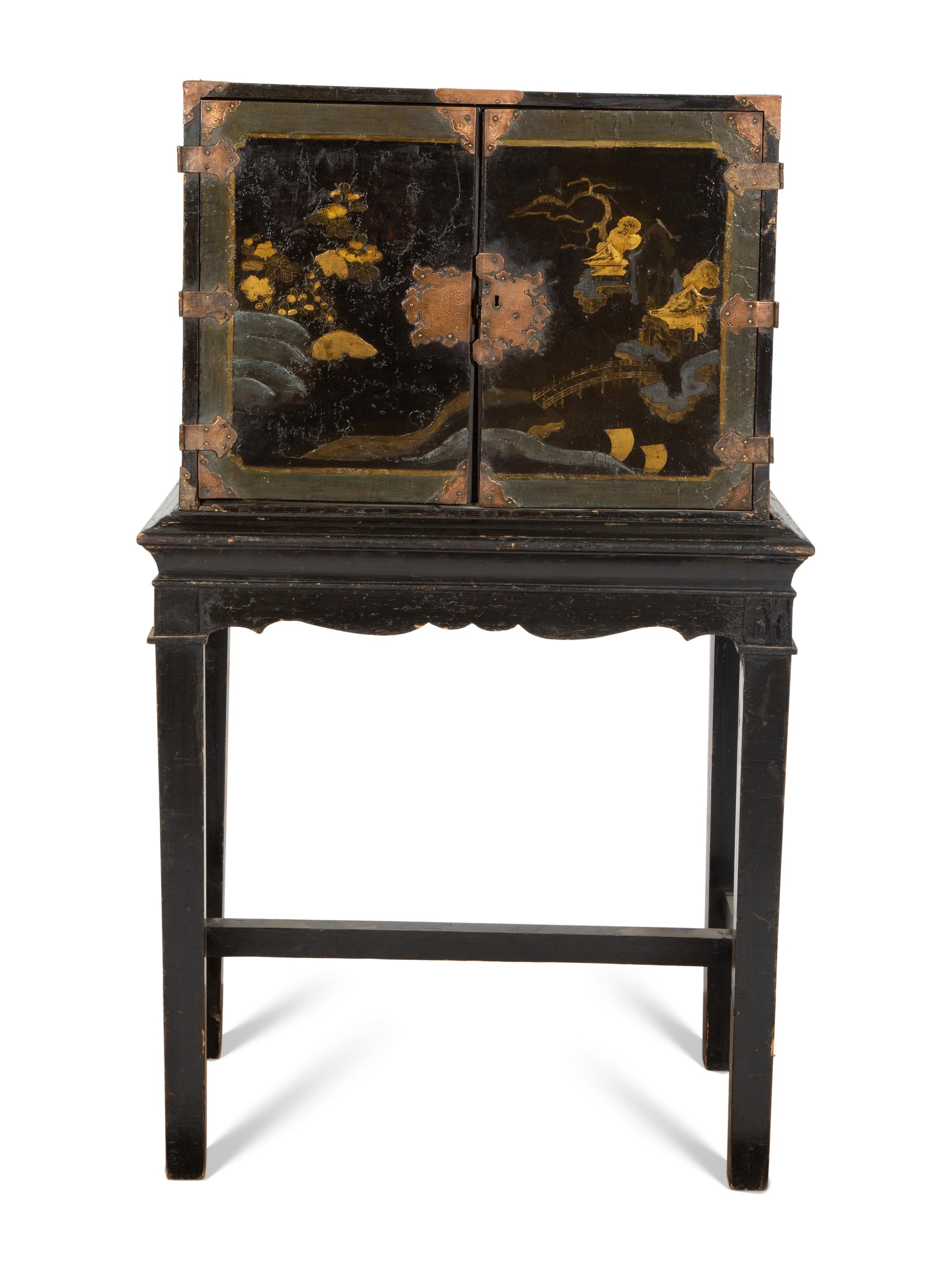 A Chinese Black and Gilt Lacquered Cabinet on Stand