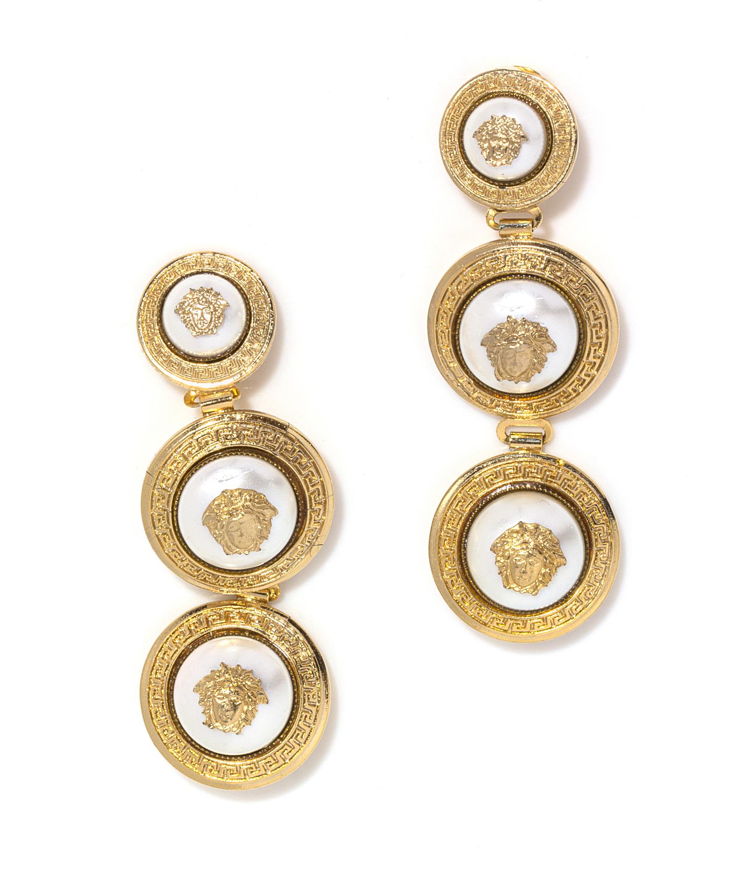A Pair of Gianni Versace Pearl Medusa Medallion Drop Earclips, Medallions: 1" x 1" and 1.25" x 1.25"; Drop: 3.5".