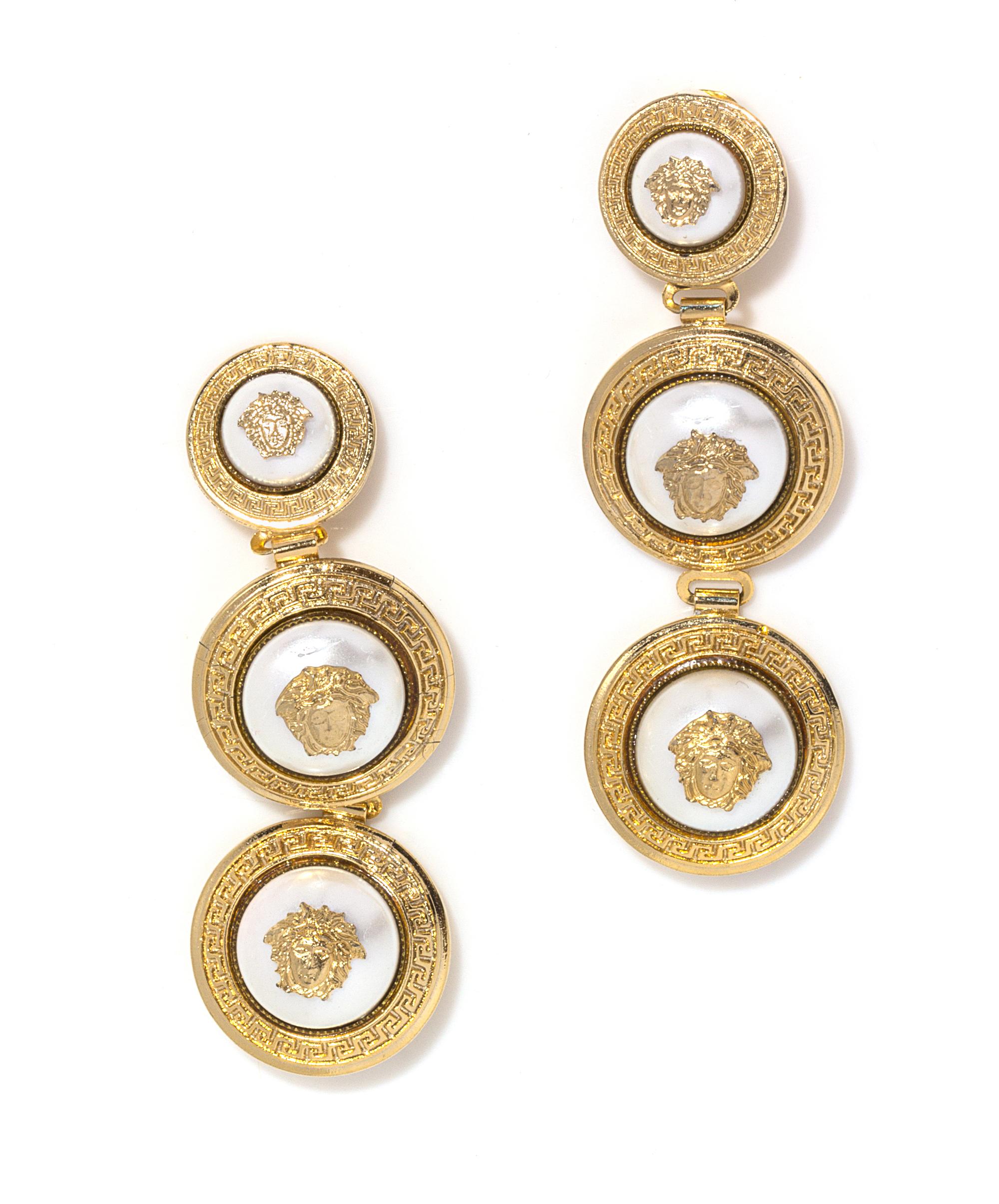 A Pair of Gianni Versace Pearl Medusa Medallion Drop Earclips, Medallions: 1" x 1" and 1.25" x 1.25"; Drop: 3.5".