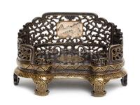 A Gilt Decorated Black Glazed Porcelain Stand Length 6 inches.