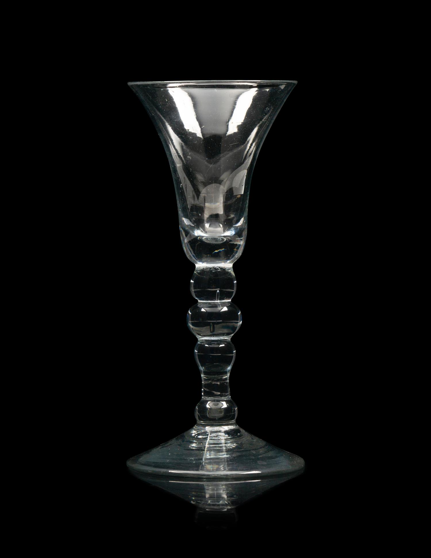 A Group of Three English Knopped Stem Wine Glasses