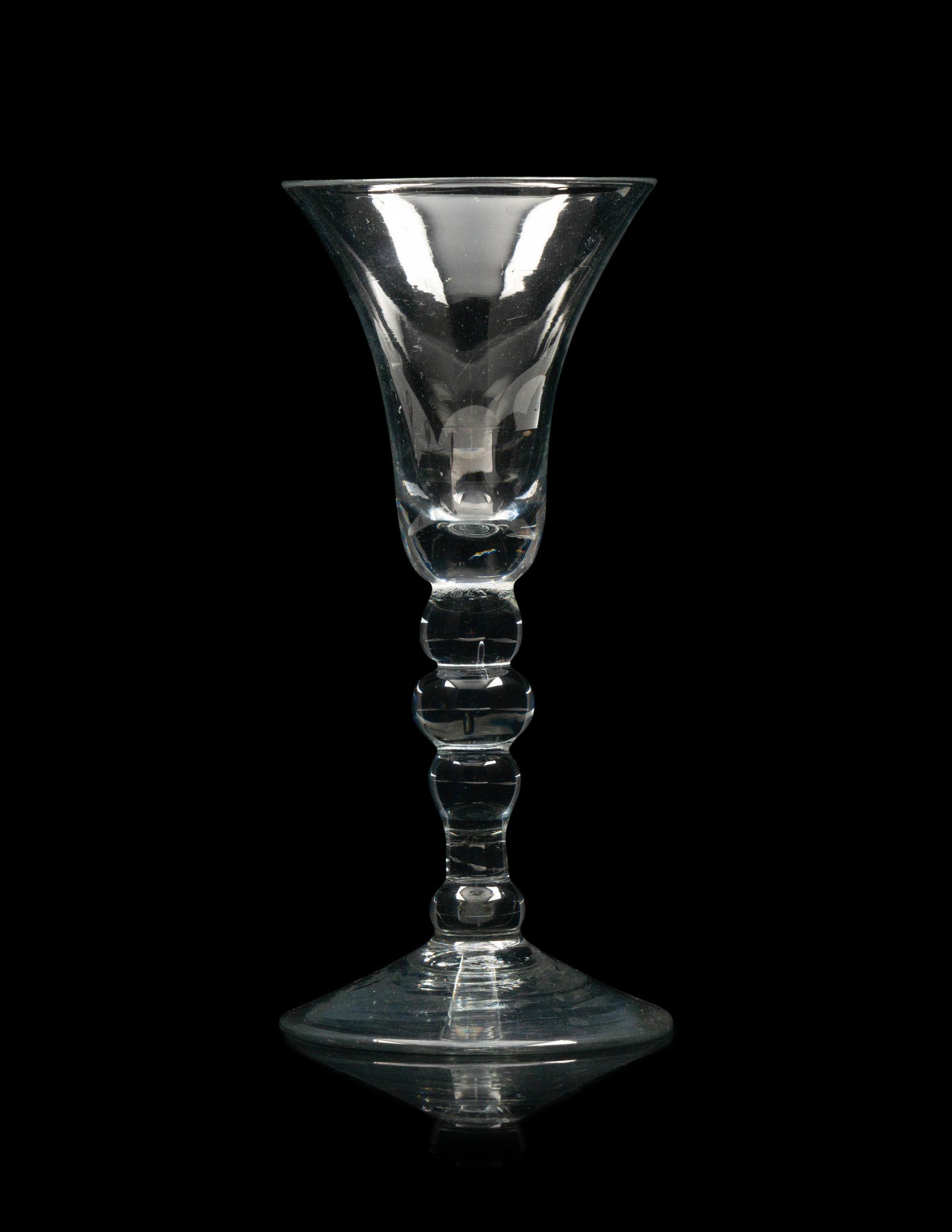 A Group of Three English Knopped Stem Wine Glasses