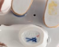 A Meissen Porcelain Figure of a Boy Drinking From a Blue Onion Bowl