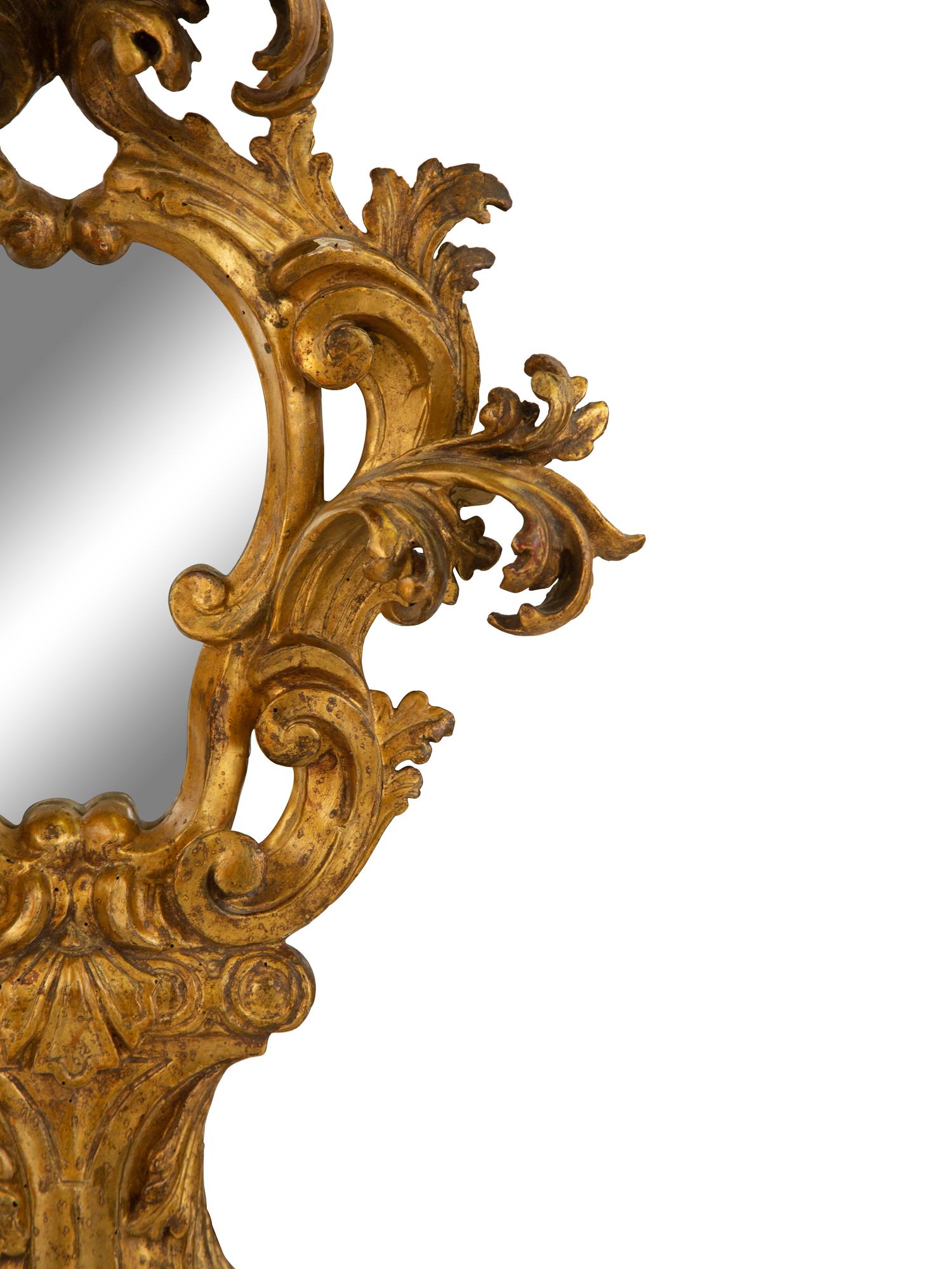 A Venetian Rococo Style Giltwood Mirror