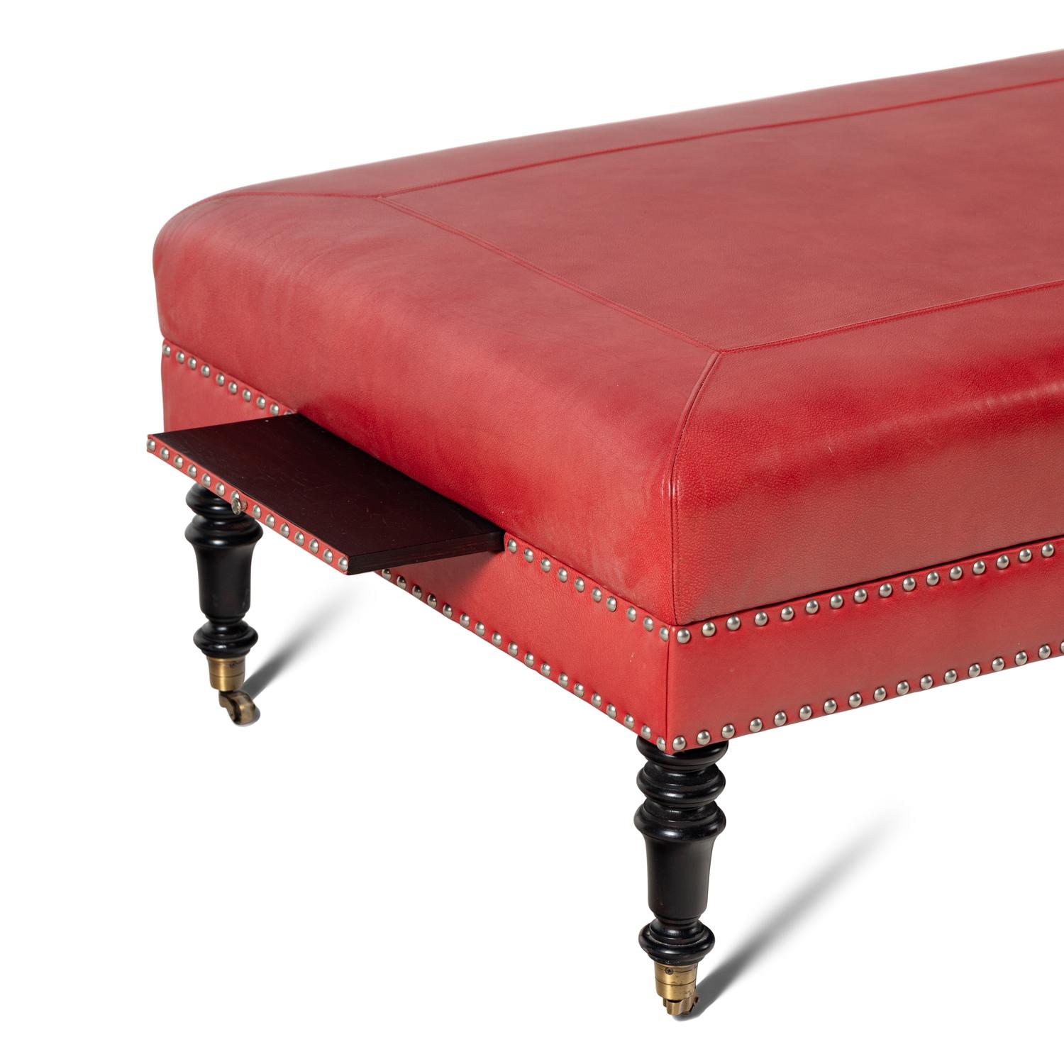 A Custom Coral Leather Upholstered Ottoman