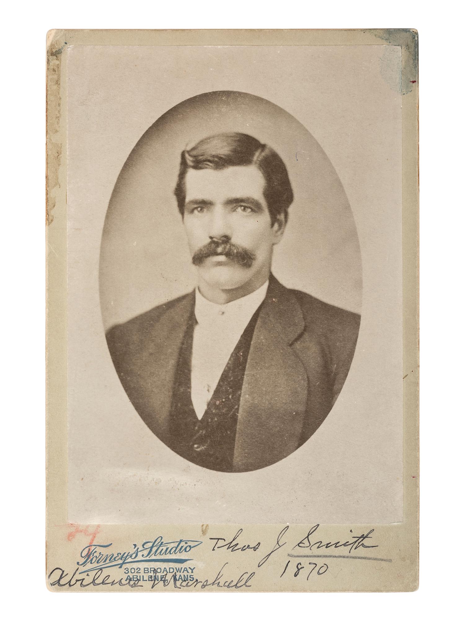 Western Lawmen Cabinet card portrait of Thomas J. Smith, marshal and chief of police in Abilene, KS, murdered by outlaws in 1870. Abilene, KS: Forney's Studio, n.d.