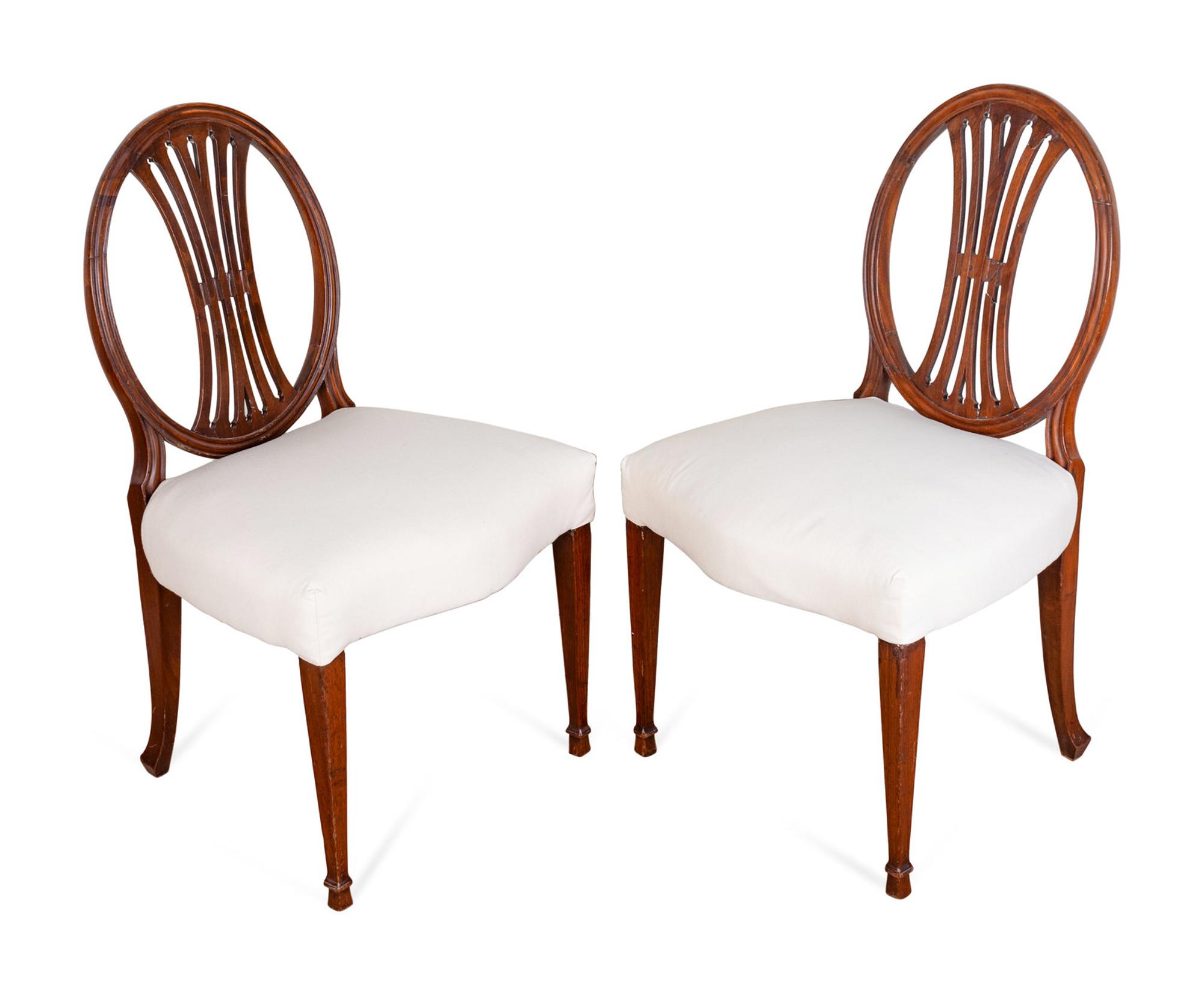 A Set of Six George III Carved Mahogany Dining Chairs