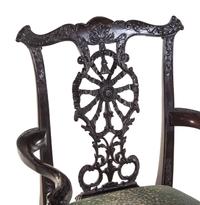 A Set of Eight George III Style Carved Mahogany Ribbon-Back Dining Chairs