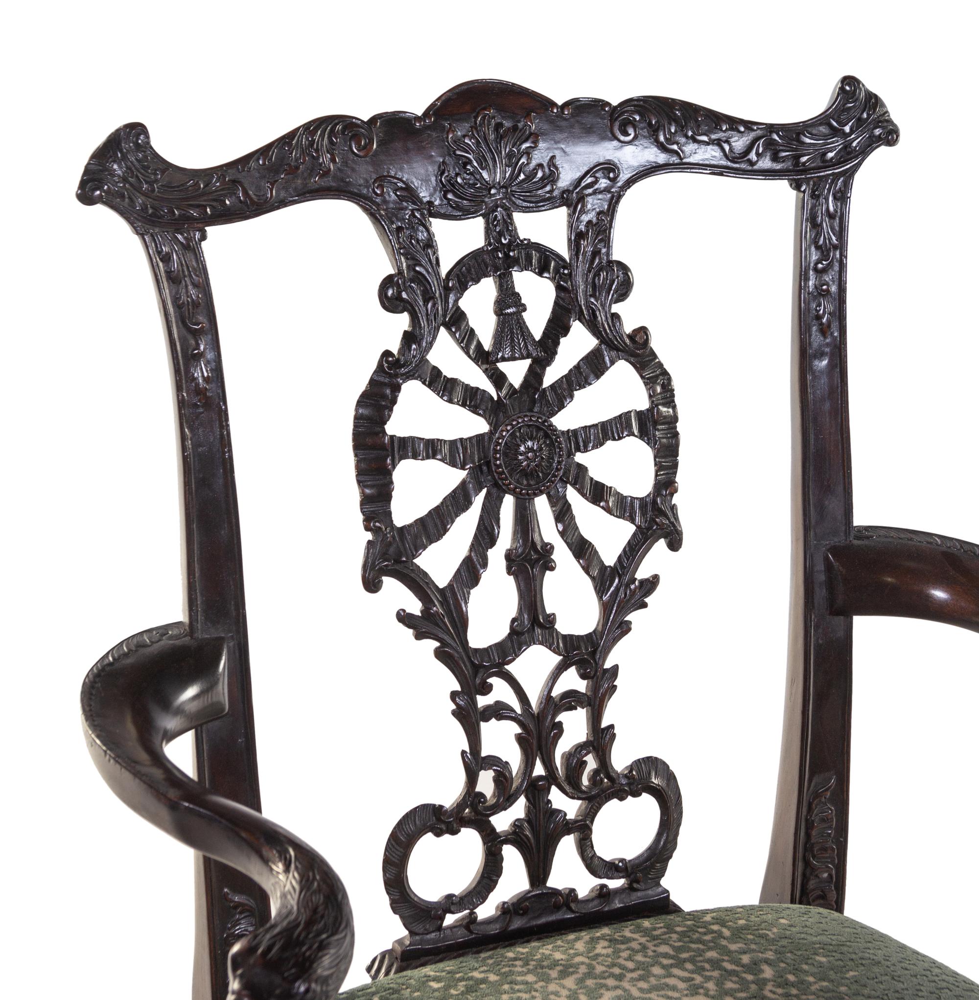 A Set of Eight George III Style Carved Mahogany Ribbon-Back Dining Chairs