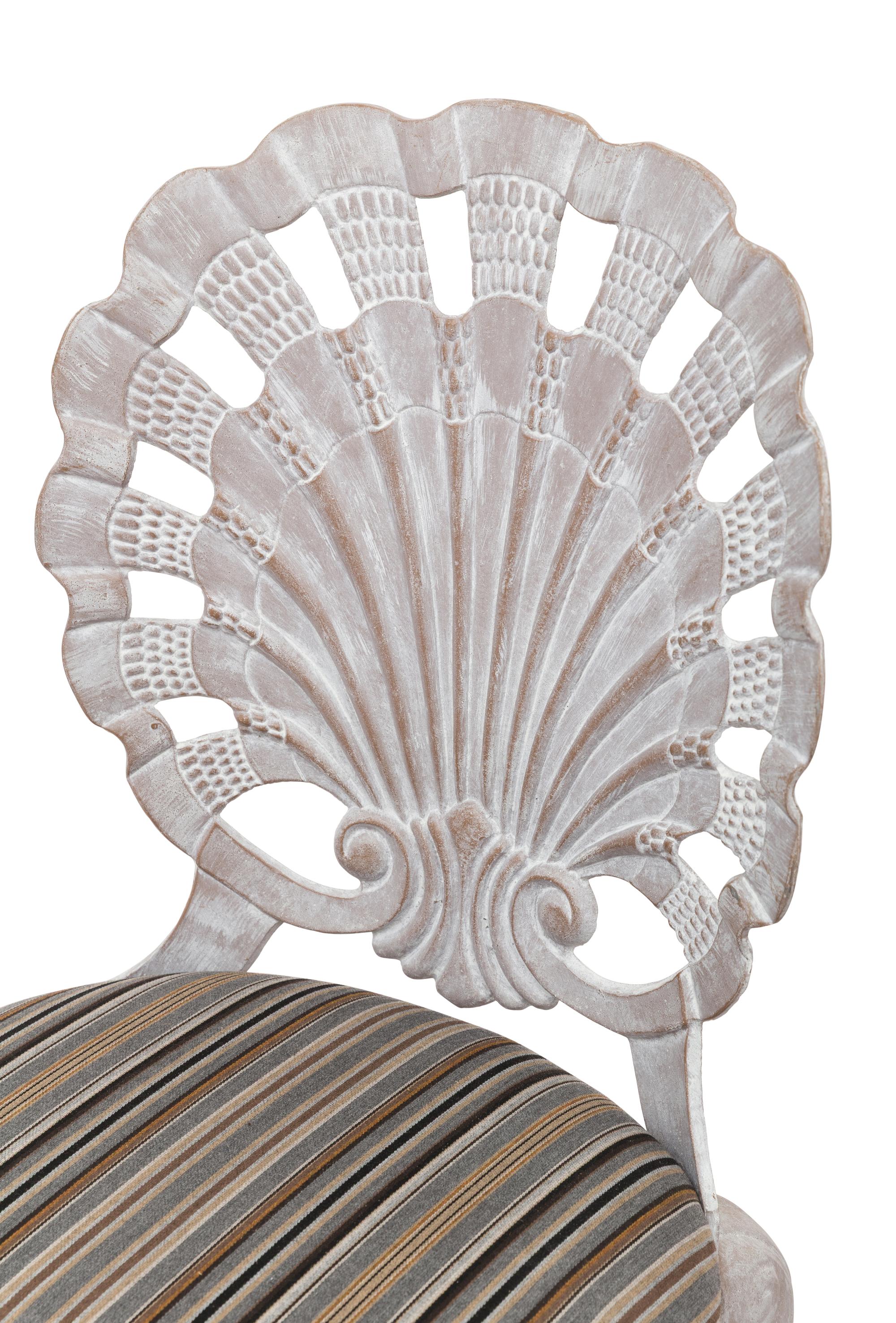 A Set of Four "Grotto" Style Cast Metal Chairs