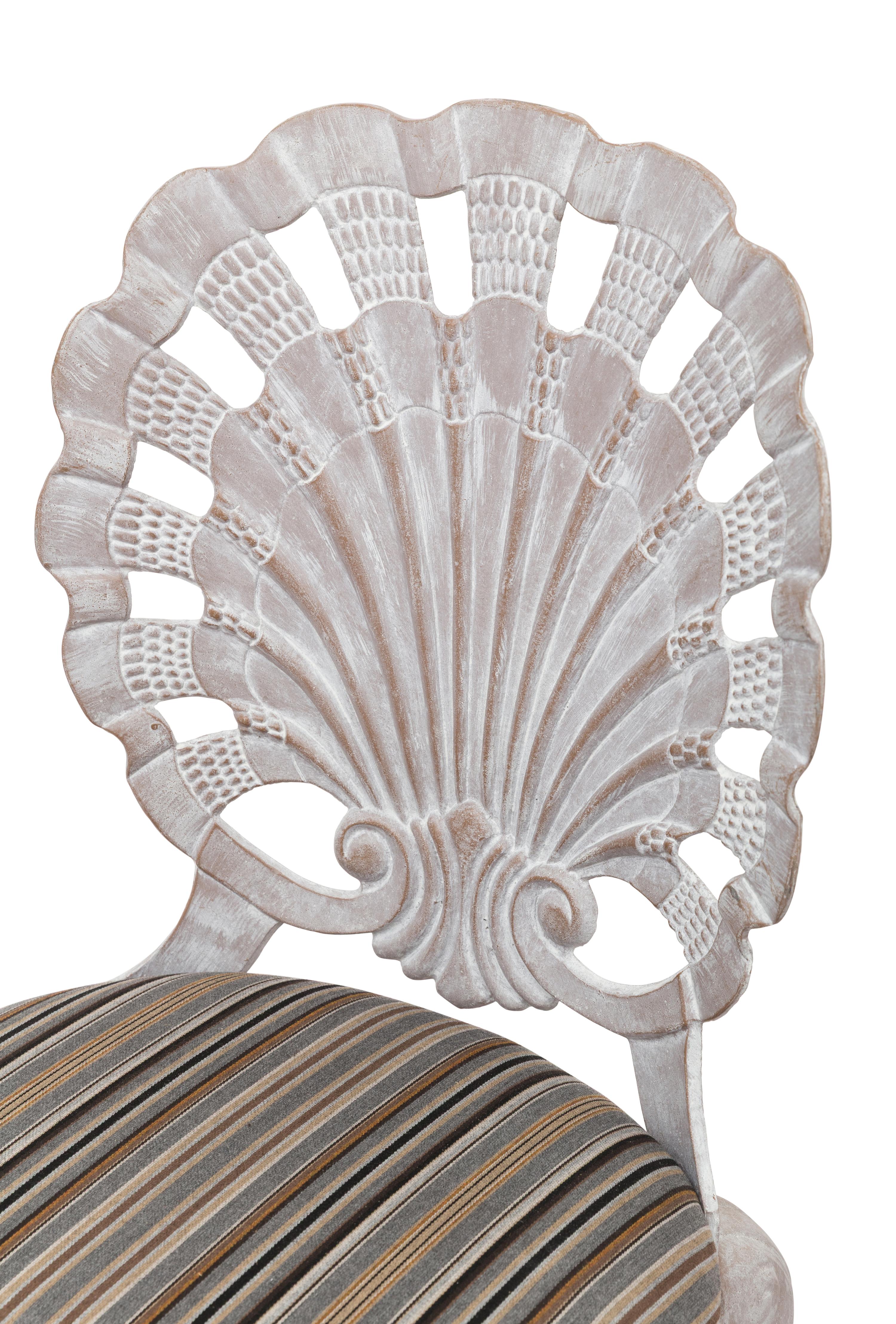 A Set of Four "Grotto" Style Cast Metal Chairs