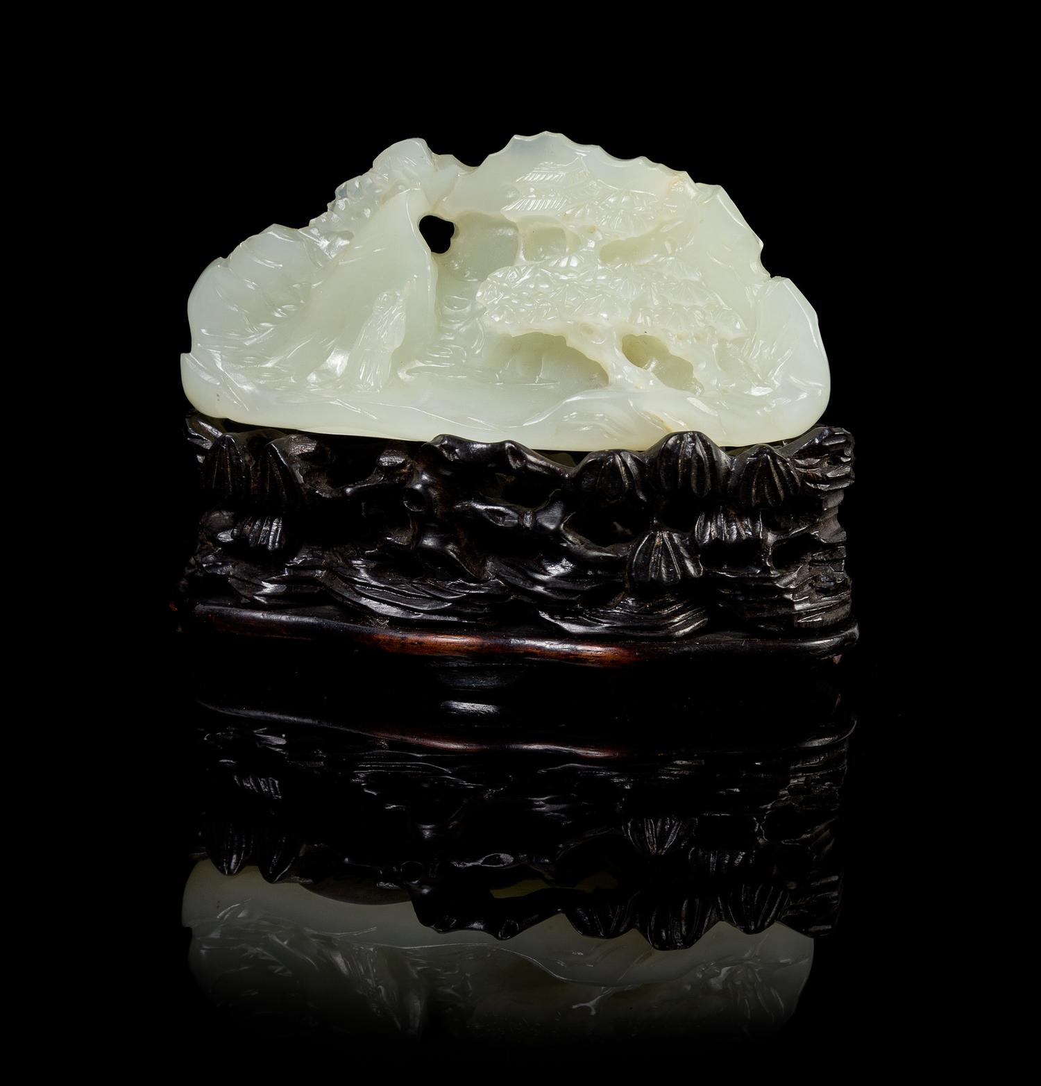 A Chinese White Jade Mountain and Stand 18TH/19TH CENTURY Height of jade 1 1/2 x width 3 1/8 inches. — 18TH/19TH CENTURY