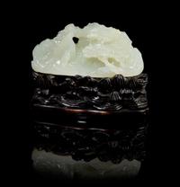 A Chinese White Jade Mountain and Stand 18TH/19TH CENTURY Height of jade 1 1/2 x width 3 1/8 inches. — 18TH/19TH CENTURY