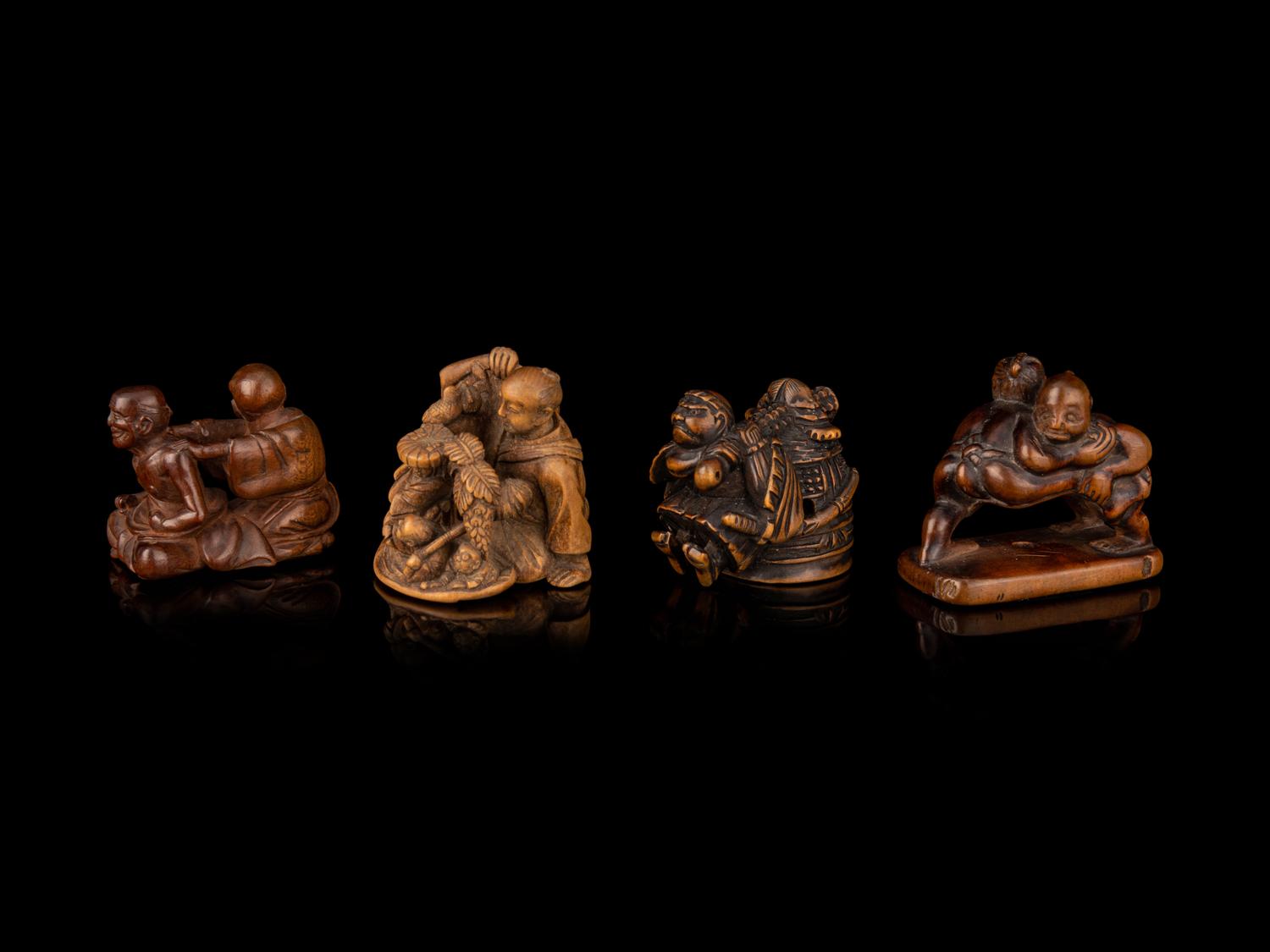 Four Japanese Carved Wood Figural-Form Netsuke