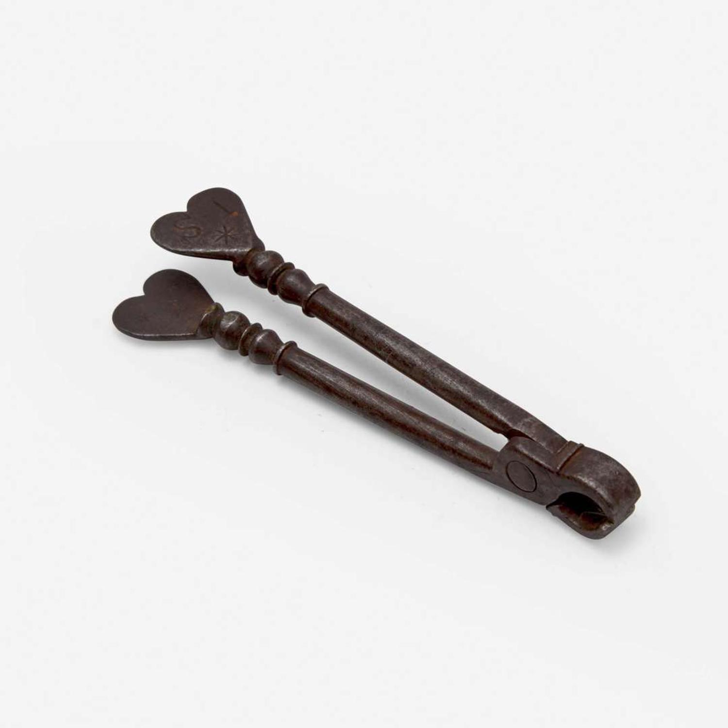 An unusual set of iron sugar nippers Dated "1785"