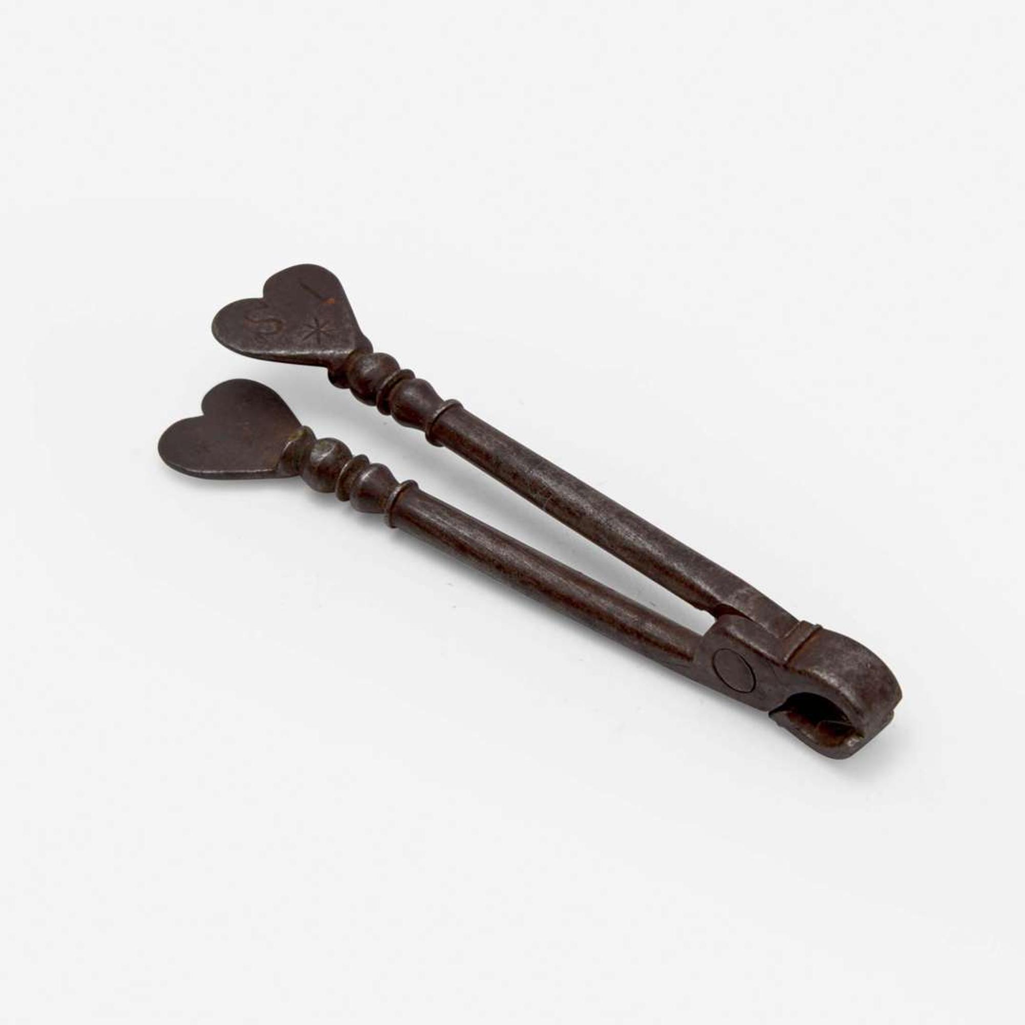 An unusual set of iron sugar nippers Dated "1785"