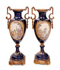 A Pair of Sèvres Style Gilt Bronze Mounted Porcelain Urns