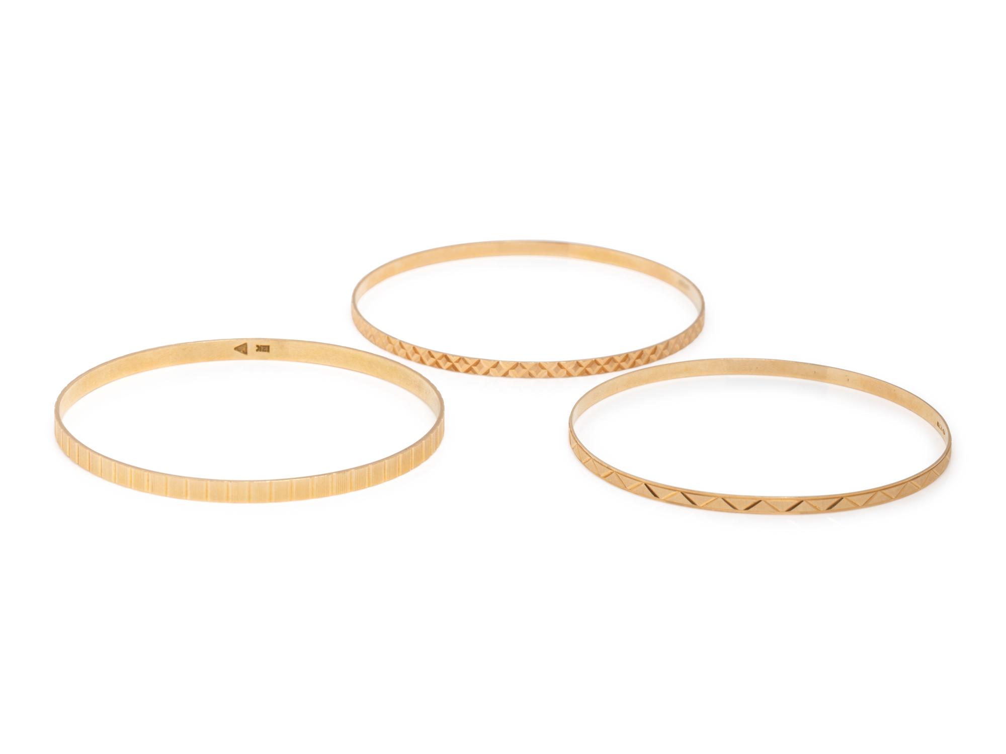 COLLECTION OF YELLOW GOLD BANGLE BRACELETS