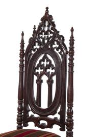 A Pair of Victorian Gothic Carved Walnut Side Chairs
