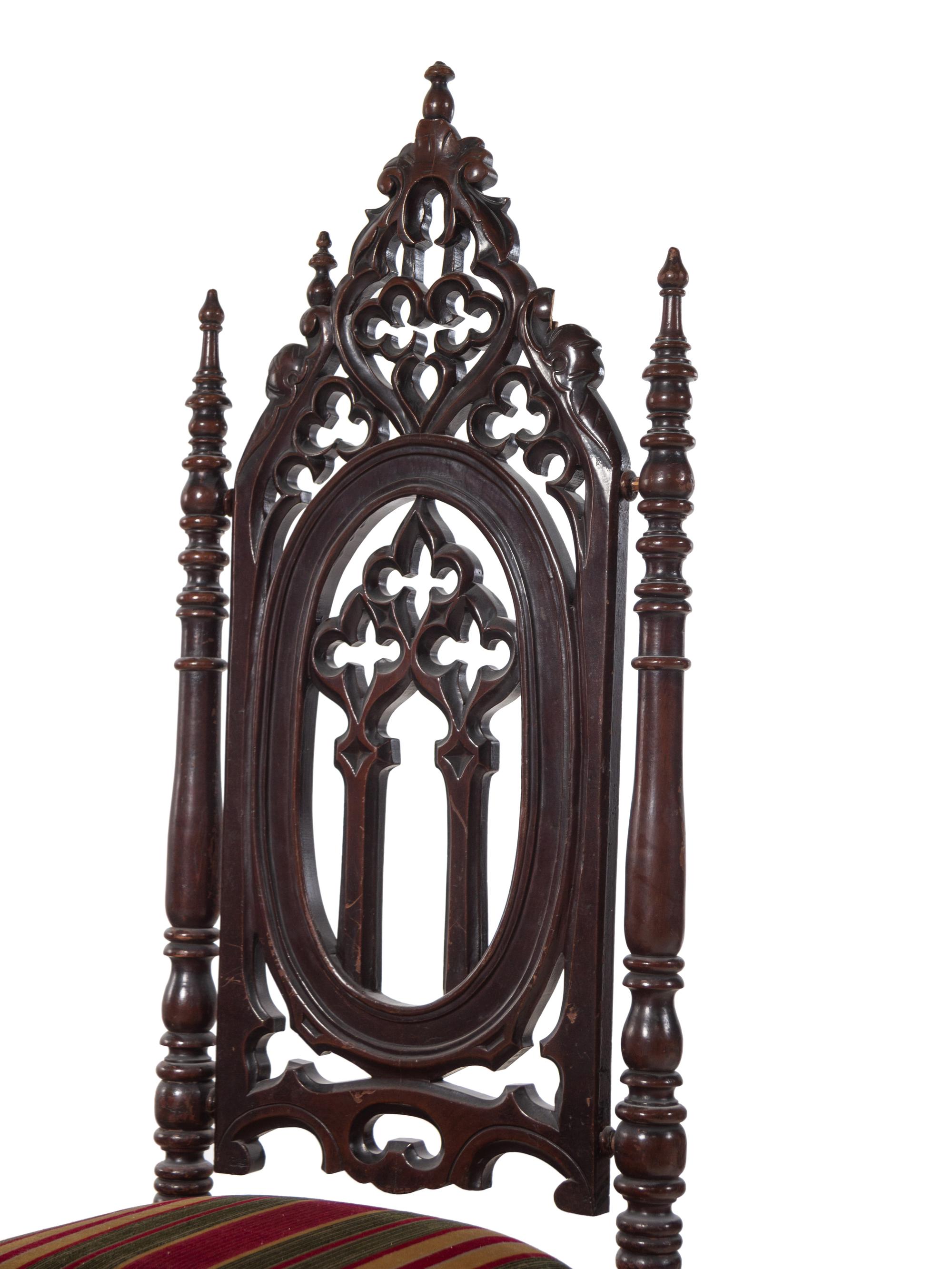 A Pair of Victorian Gothic Carved Walnut Side Chairs