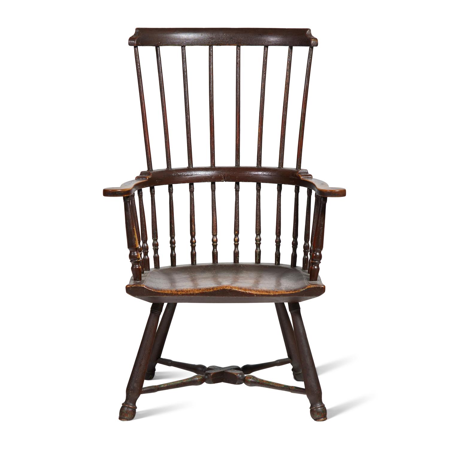 A Turned and Black-Painted Comb-Back Windsor Armchair