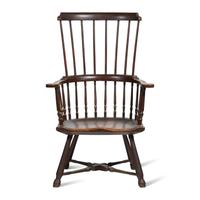 A Turned and Black-Painted Comb-Back Windsor Armchair