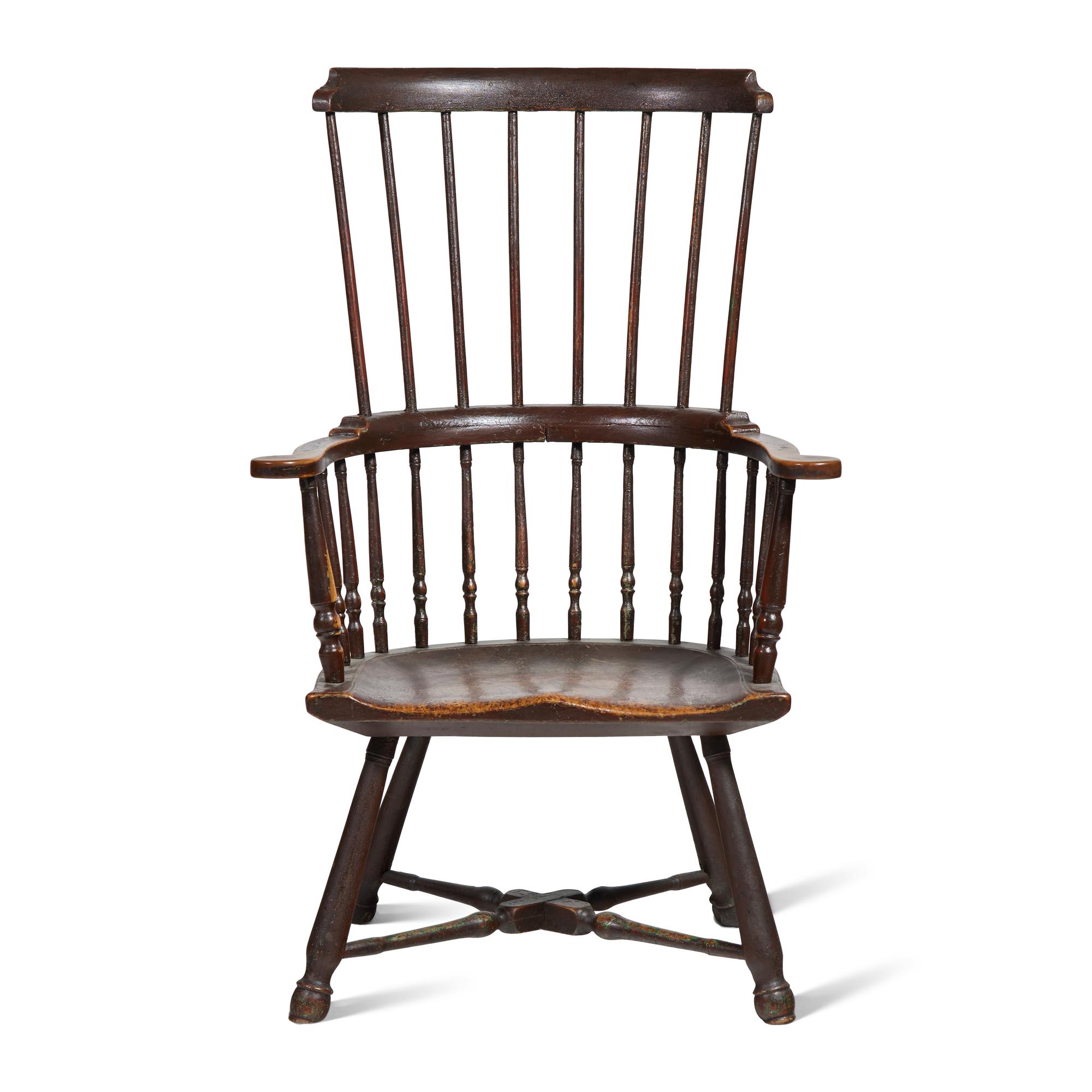 A Turned and Black-Painted Comb-Back Windsor Armchair