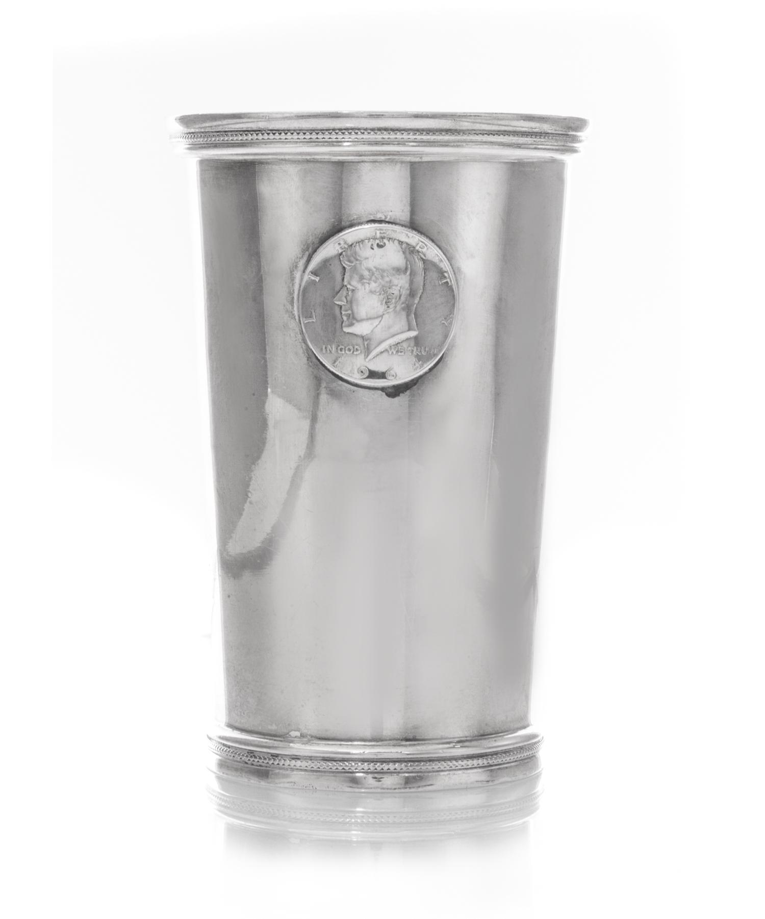A Mexican Silver Beaker, L.Maciel, 20th Century, tapering, applied with a 1964 American Silver Kennedy Half-Dollar to one side.
