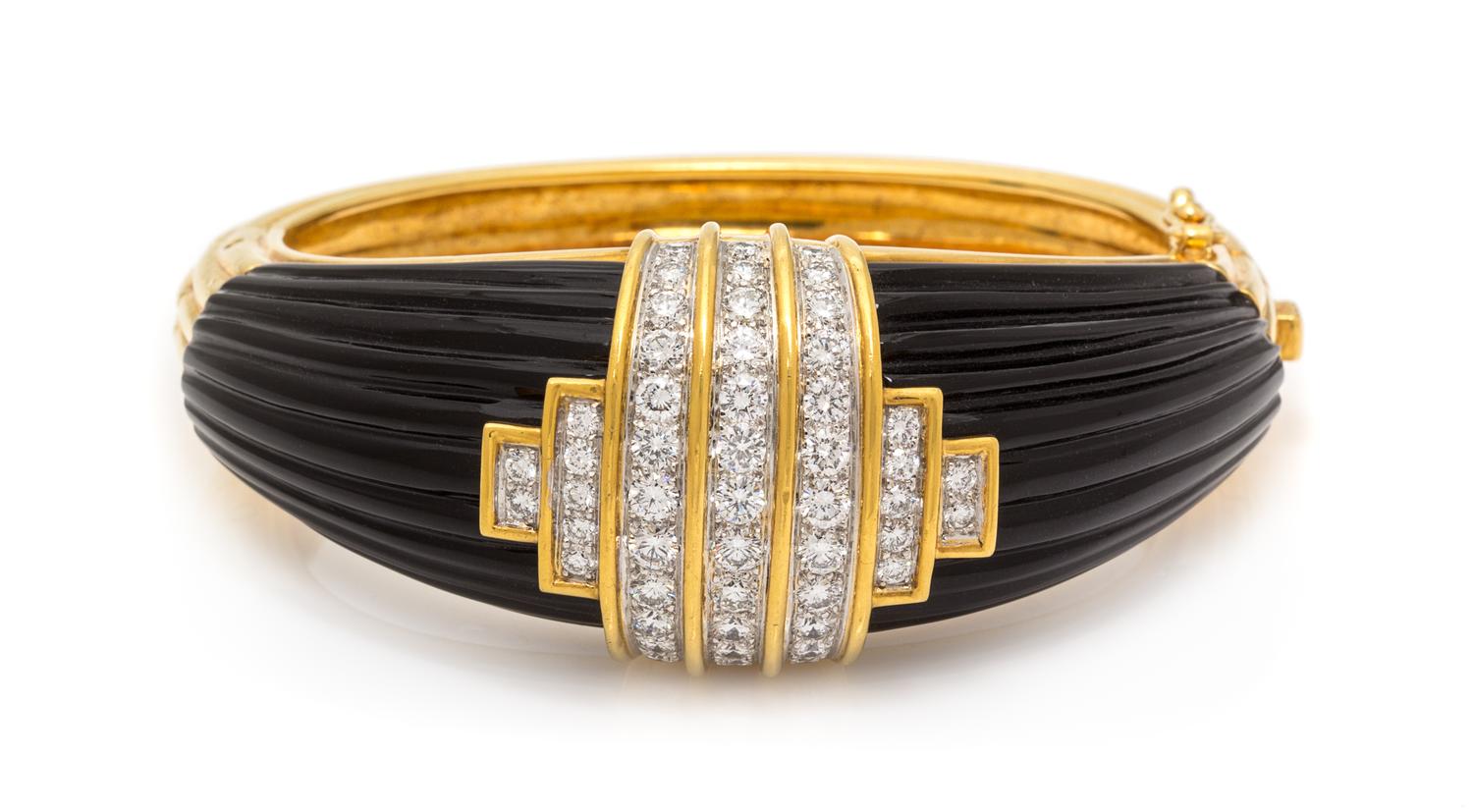 An 18 Karat Yellow Gold, Diamond and Onyx Bangle Bracelet, Montreaux, 69.45 dwts.