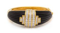 An 18 Karat Yellow Gold, Diamond and Onyx Bangle Bracelet, Montreaux, 69.45 dwts.
