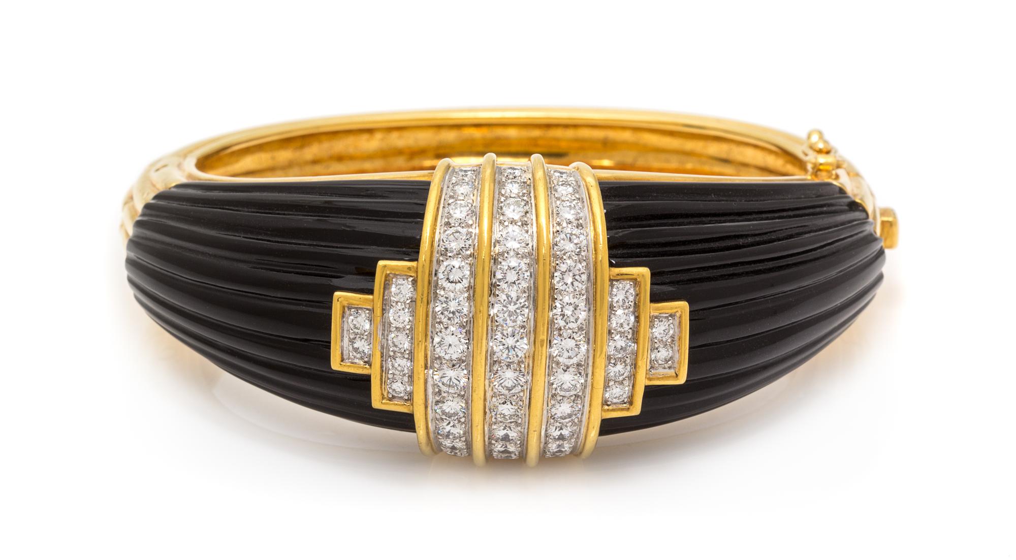 An 18 Karat Yellow Gold, Diamond and Onyx Bangle Bracelet, Montreaux, 69.45 dwts.