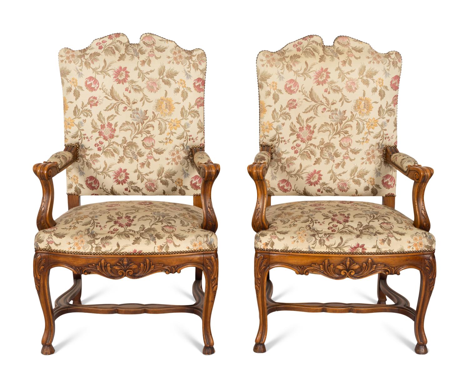 A Set of Six Régence Style Carved Walnut Fauteuils