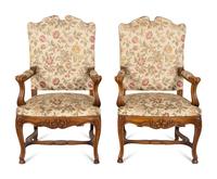 A Set of Six Régence Style Carved Walnut Fauteuils