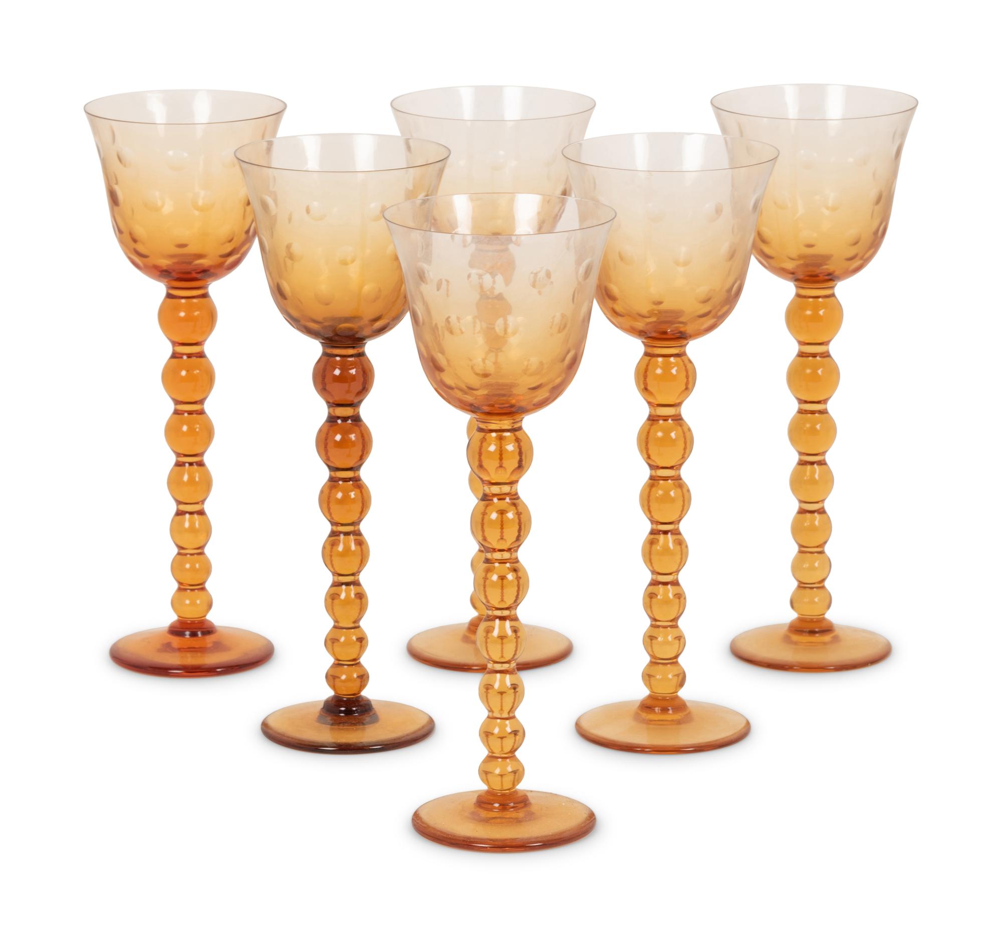 A Set of Fifteen St. Louis Amber Glass Stems