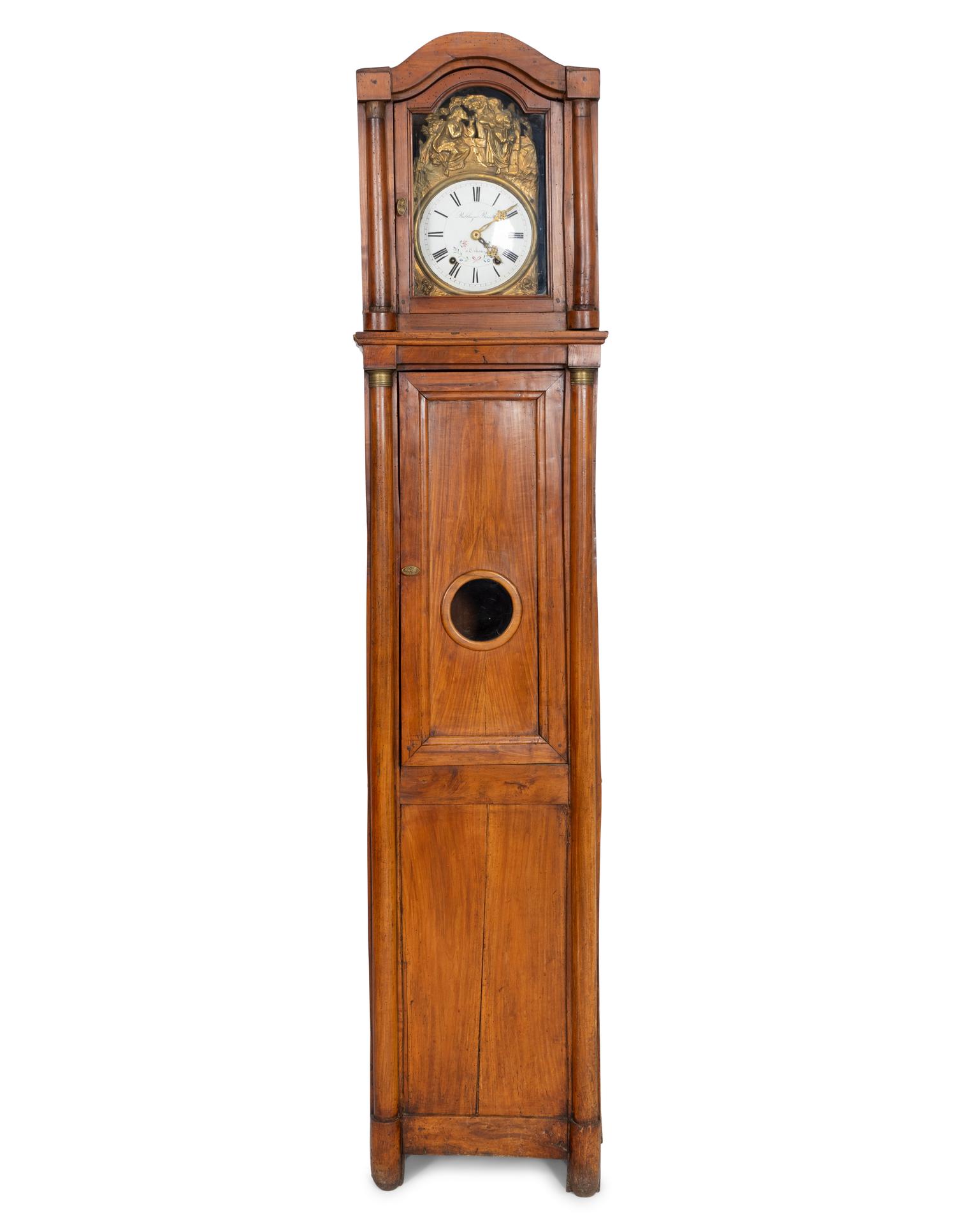 A French Repoussed Brass Comtoise Clock in Provincial Fruitwood Tall Case