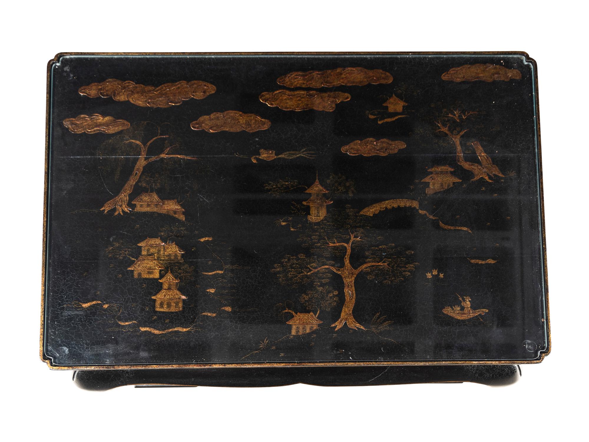 A Contemporary Ebonized and Parcel-Gilt Low Table