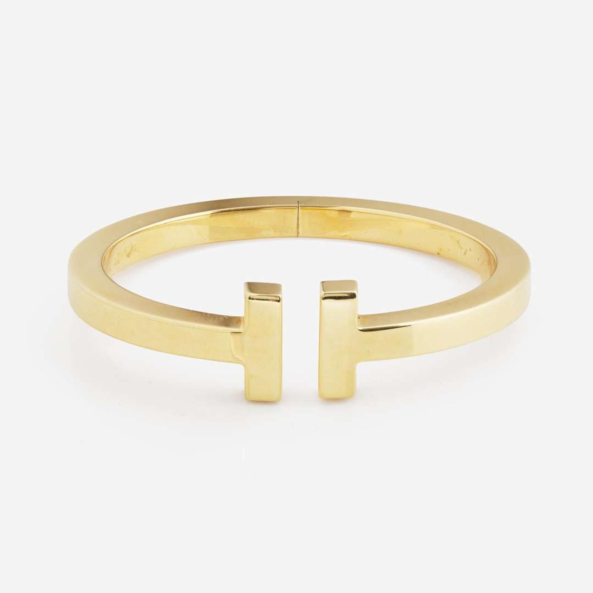 An 18K Yellow Gold " T" Bracelet by Tiffany & Co.