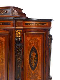 A Victorian Parcel Gilt, Ebonized and Inlaid Rosewood Parlor Cabinet
