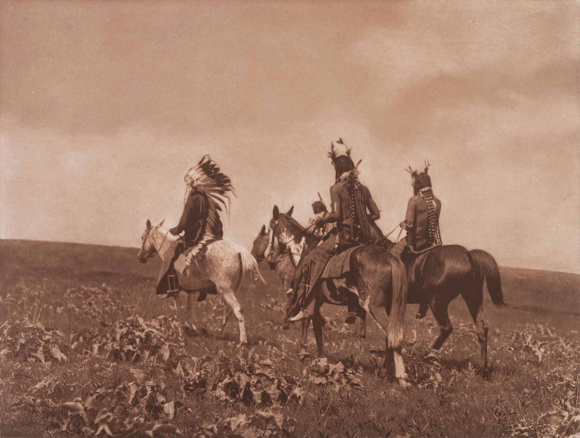 CURTIS, Edward (1868-1952), photographer. A group of 2 portfolio photogravures featuring Apsaroke subjects.
