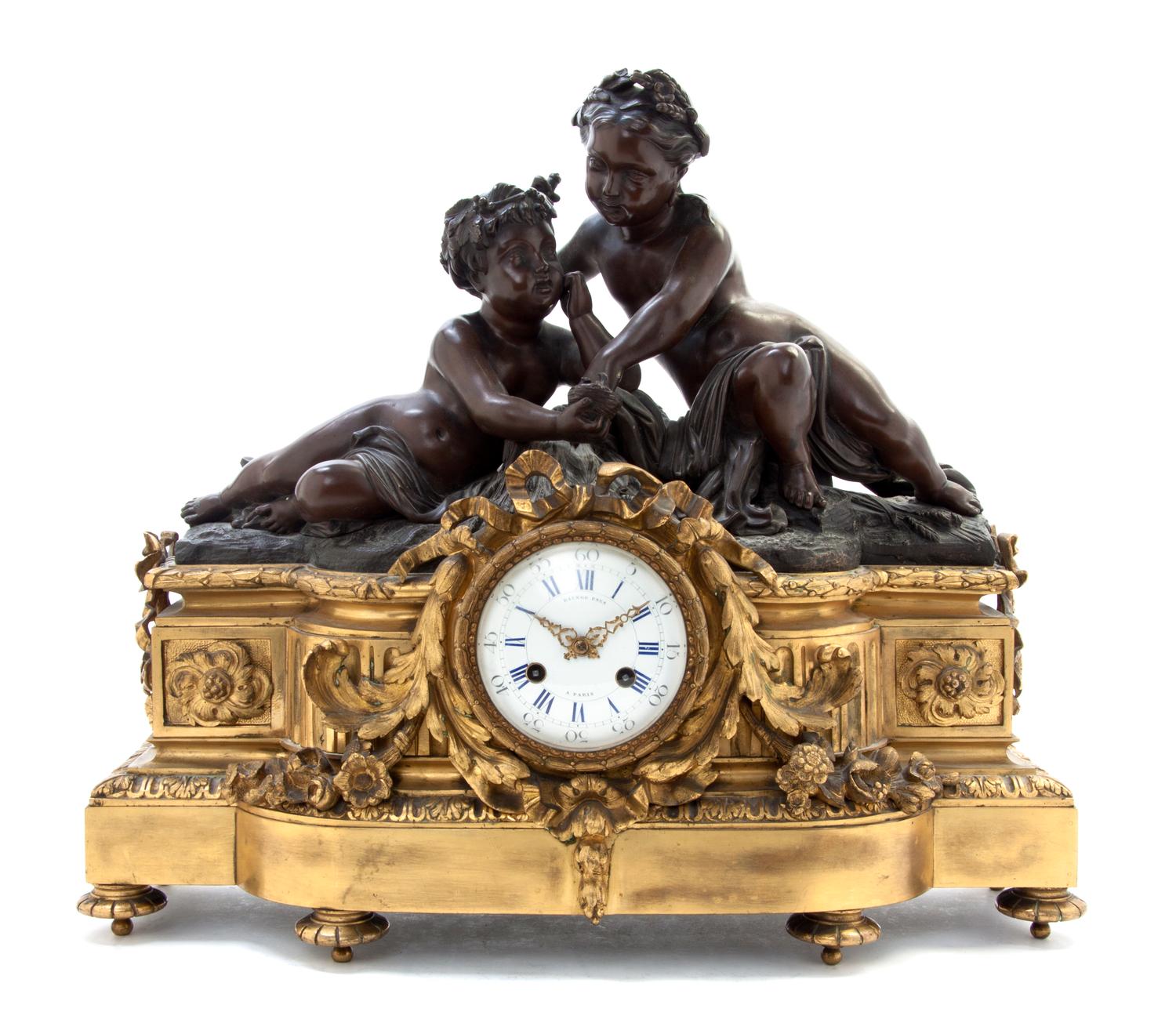 A Louis XVI Style Gilt and Patinated Bronze Figural Mantel Clock, Raingo Freres, Width 20 inches.