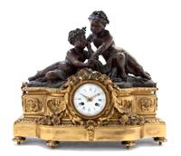 A Louis XVI Style Gilt and Patinated Bronze Figural Mantel Clock, Raingo Freres, Width 20 inches.
