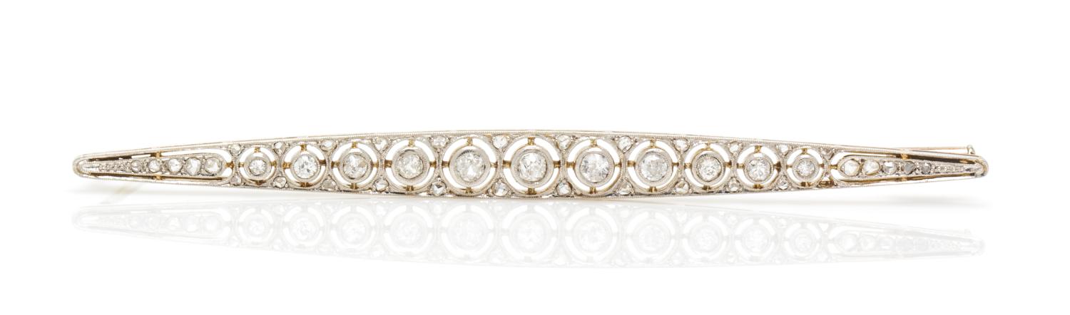 An Art Deco Platinum Topped Gold and Diamond Bar Brooch, French, 5.60 dwts.