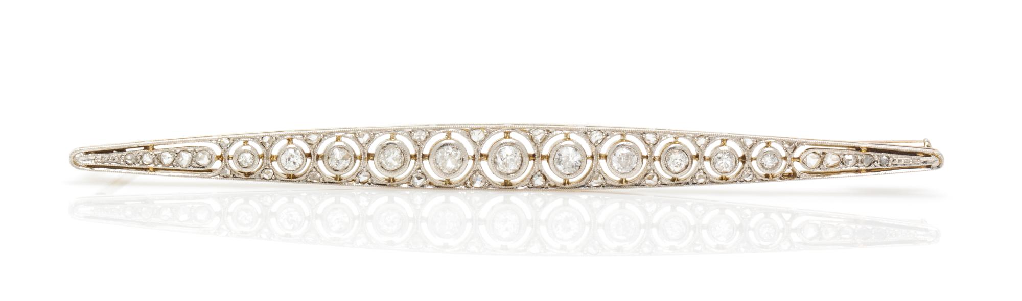 An Art Deco Platinum Topped Gold and Diamond Bar Brooch, French, 5.60 dwts.