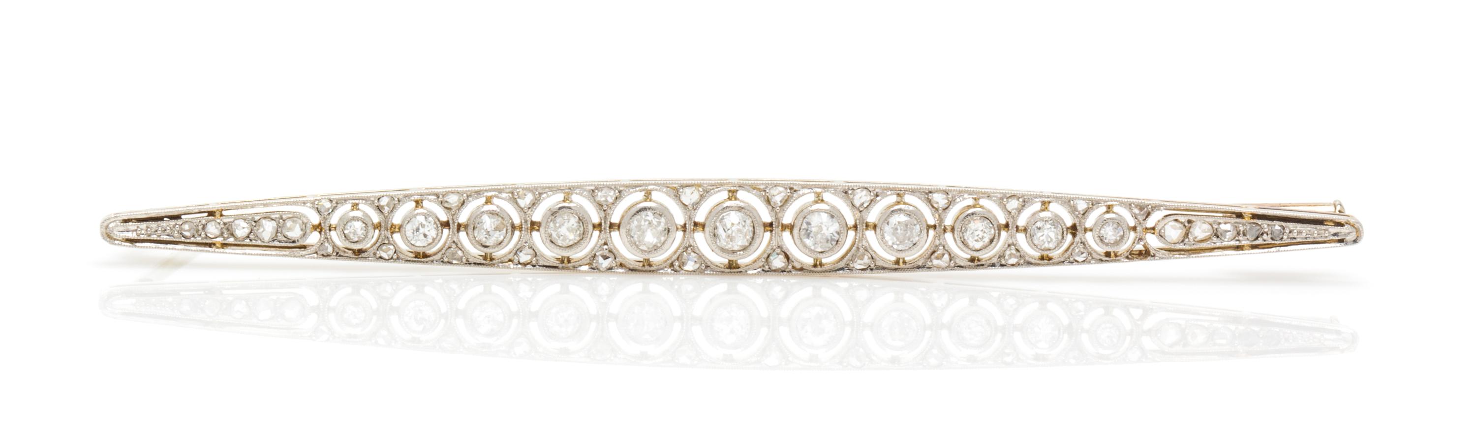 An Art Deco Platinum Topped Gold and Diamond Bar Brooch, French, 5.60 dwts.