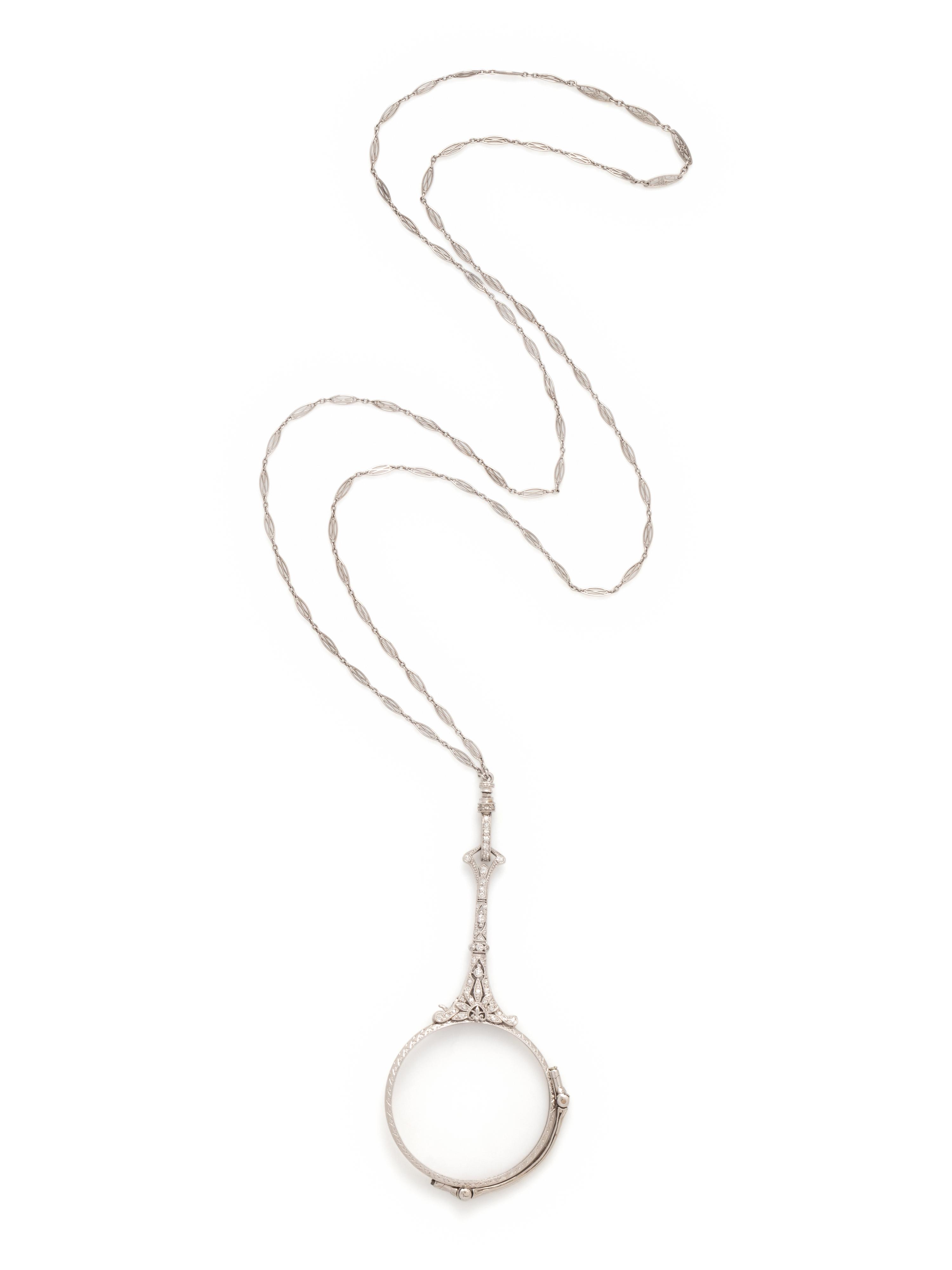 EDWARDIAN, PLATINUM AND DIAMOND LORGNETTE WITH LONGCHAIN