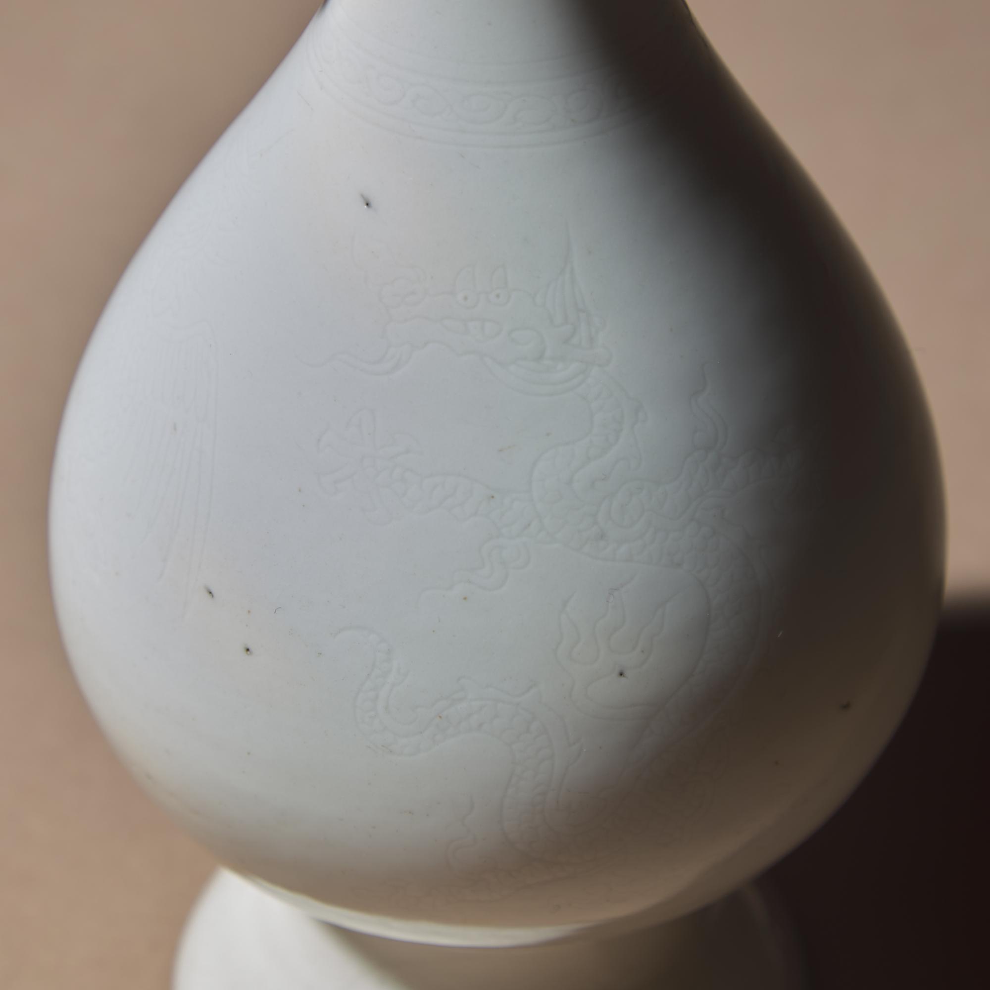 Two Chinese White Glazed Porcelain Vases, Qing Dynasty — 清 雙龍耳暗刻龍鳳紋白釉瓶及白釉四方小瓶