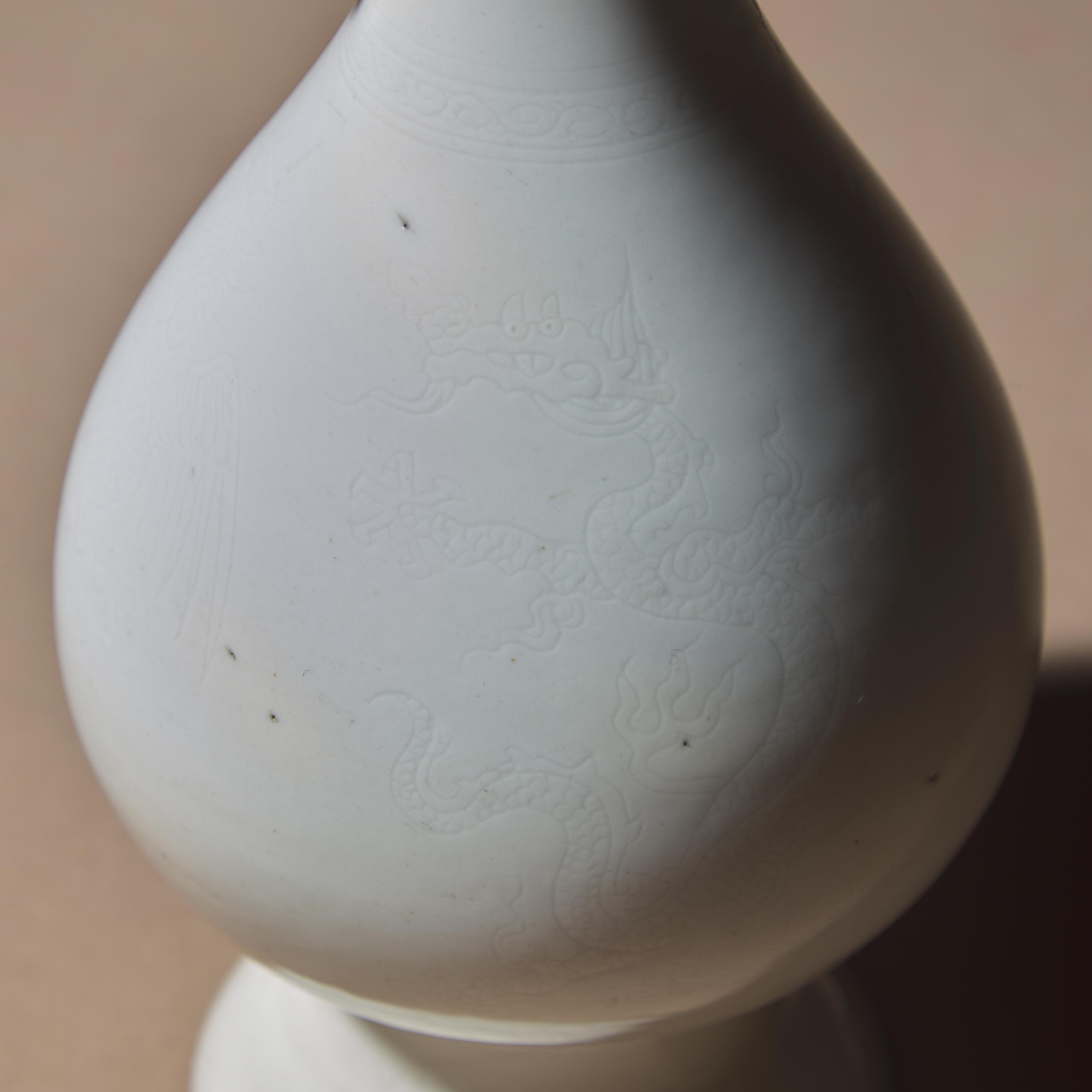Two Chinese White Glazed Porcelain Vases, Qing Dynasty — 清 雙龍耳暗刻龍鳳紋白釉瓶及白釉四方小瓶
