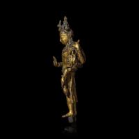 A Nepalese Gilt Bronze Standing Figure of Avalokiteshvara, 14th/15th Century 十四/十五世紀 尼泊爾銅鎏金菩薩立像