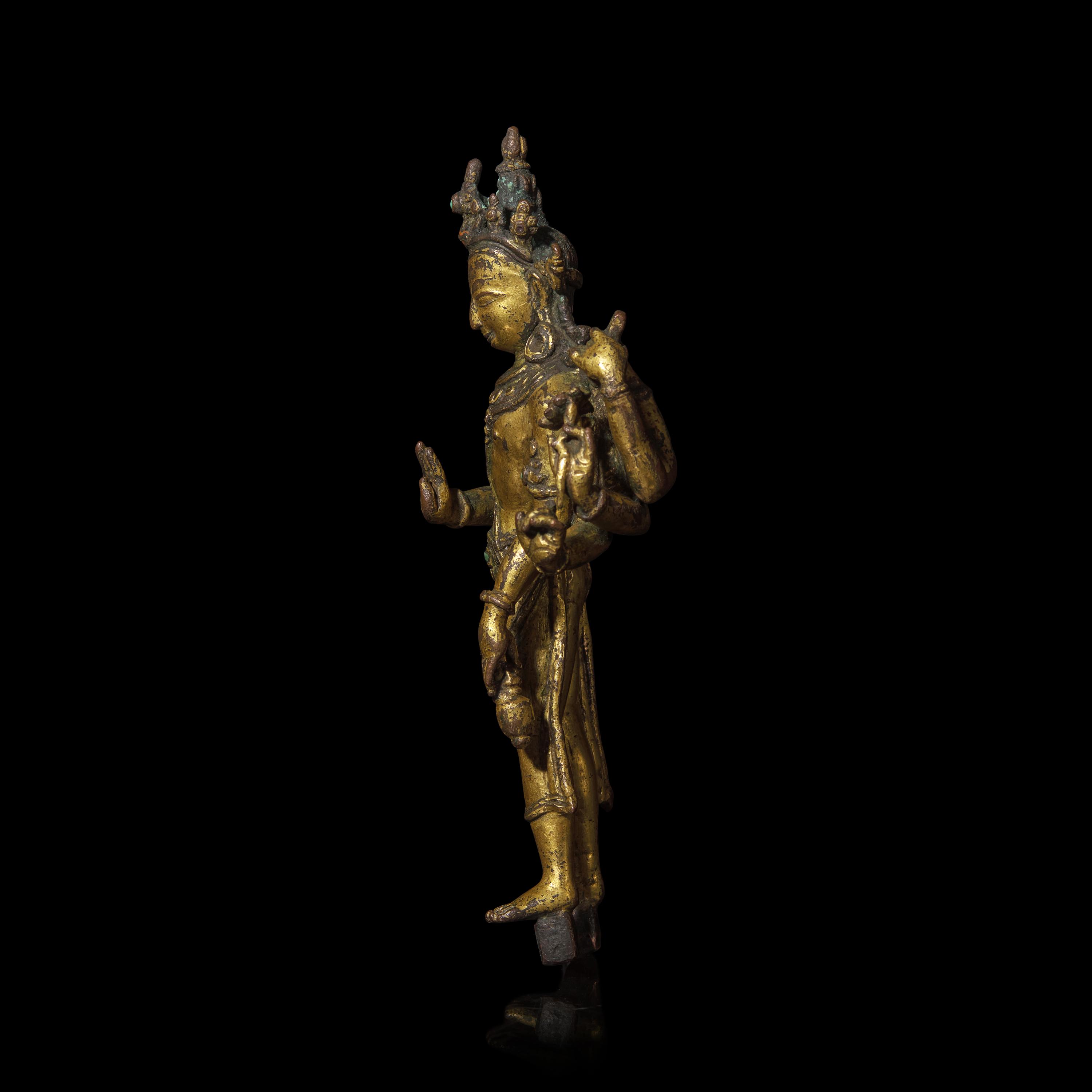 A Nepalese Gilt Bronze Standing Figure of Avalokiteshvara, 14th/15th Century 十四/十五世紀 尼泊爾銅鎏金菩薩立像