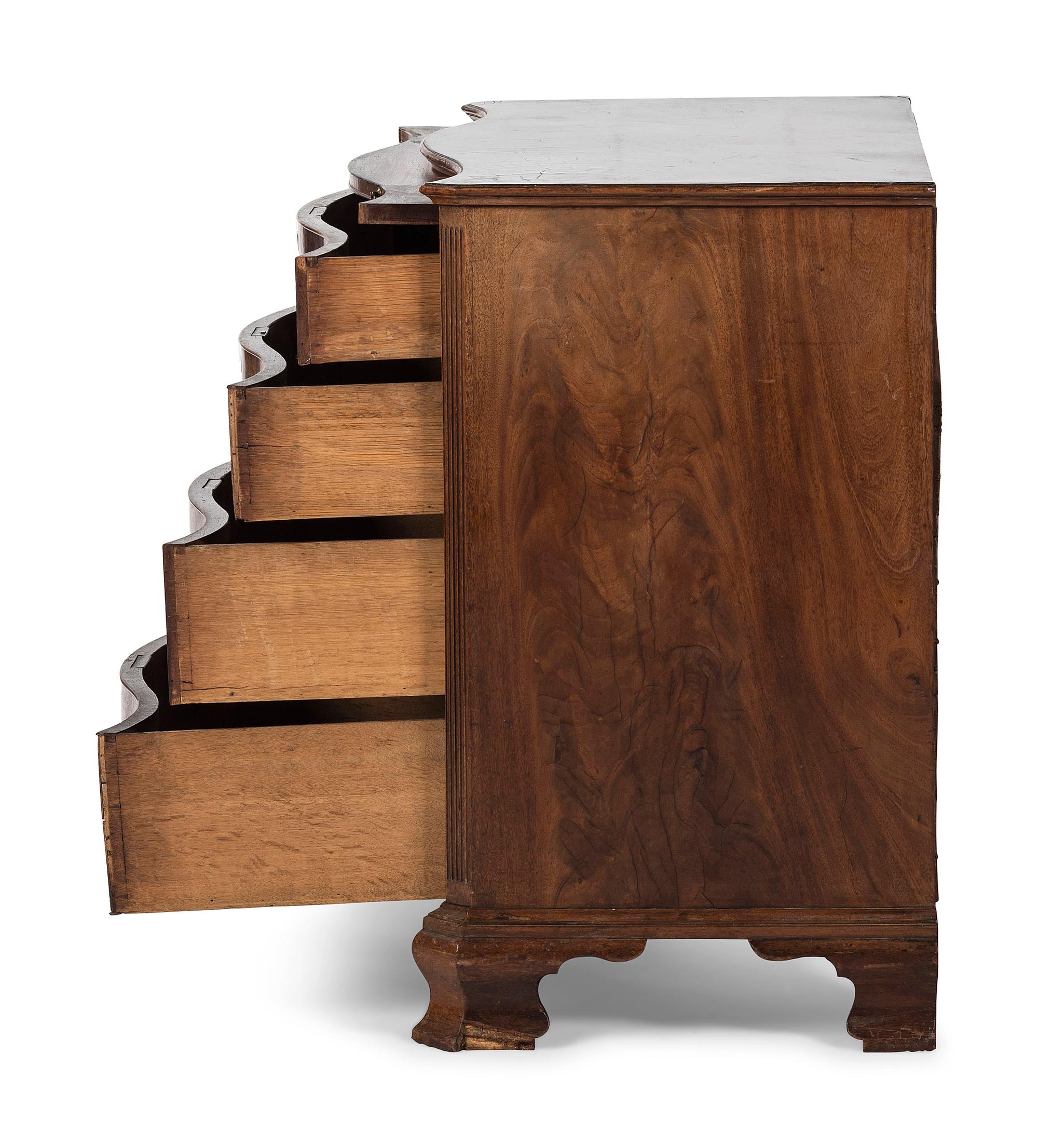 A George III Figured Mahogany Serpentine Front Bachelor's Chest